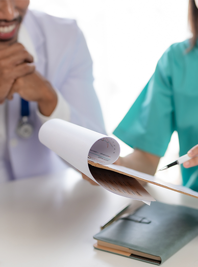 GP and nurse reviewing patient records and a care plan at Mambourin Doctors.